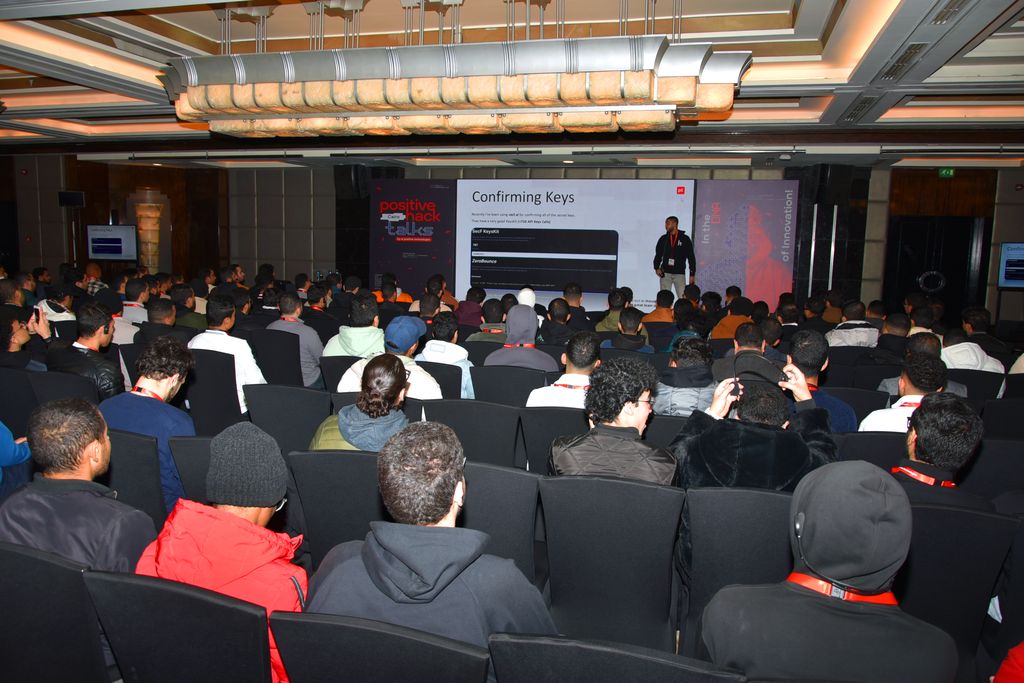 A full hall watching a talk