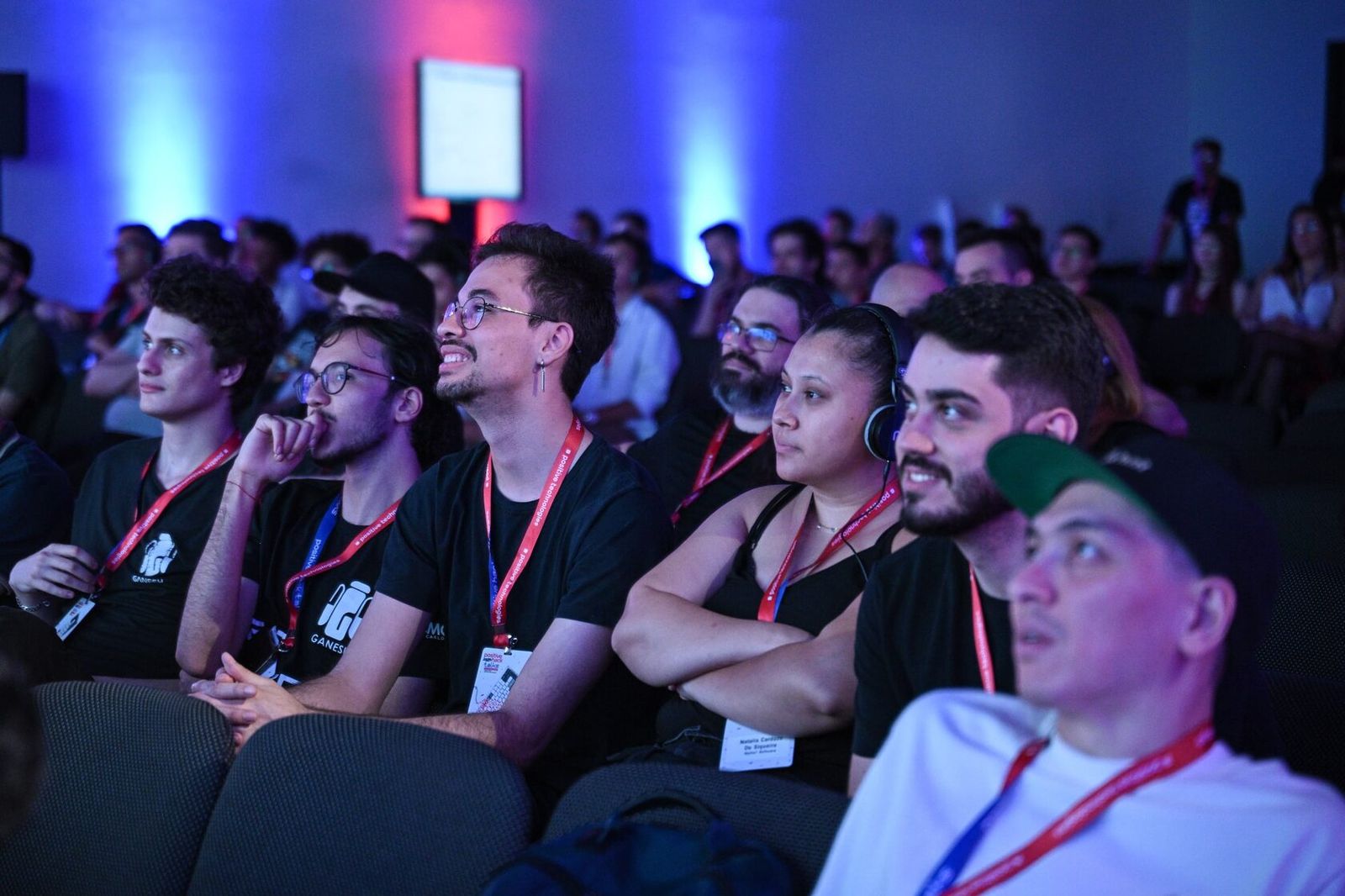 Attendees in the audience listening to a talk